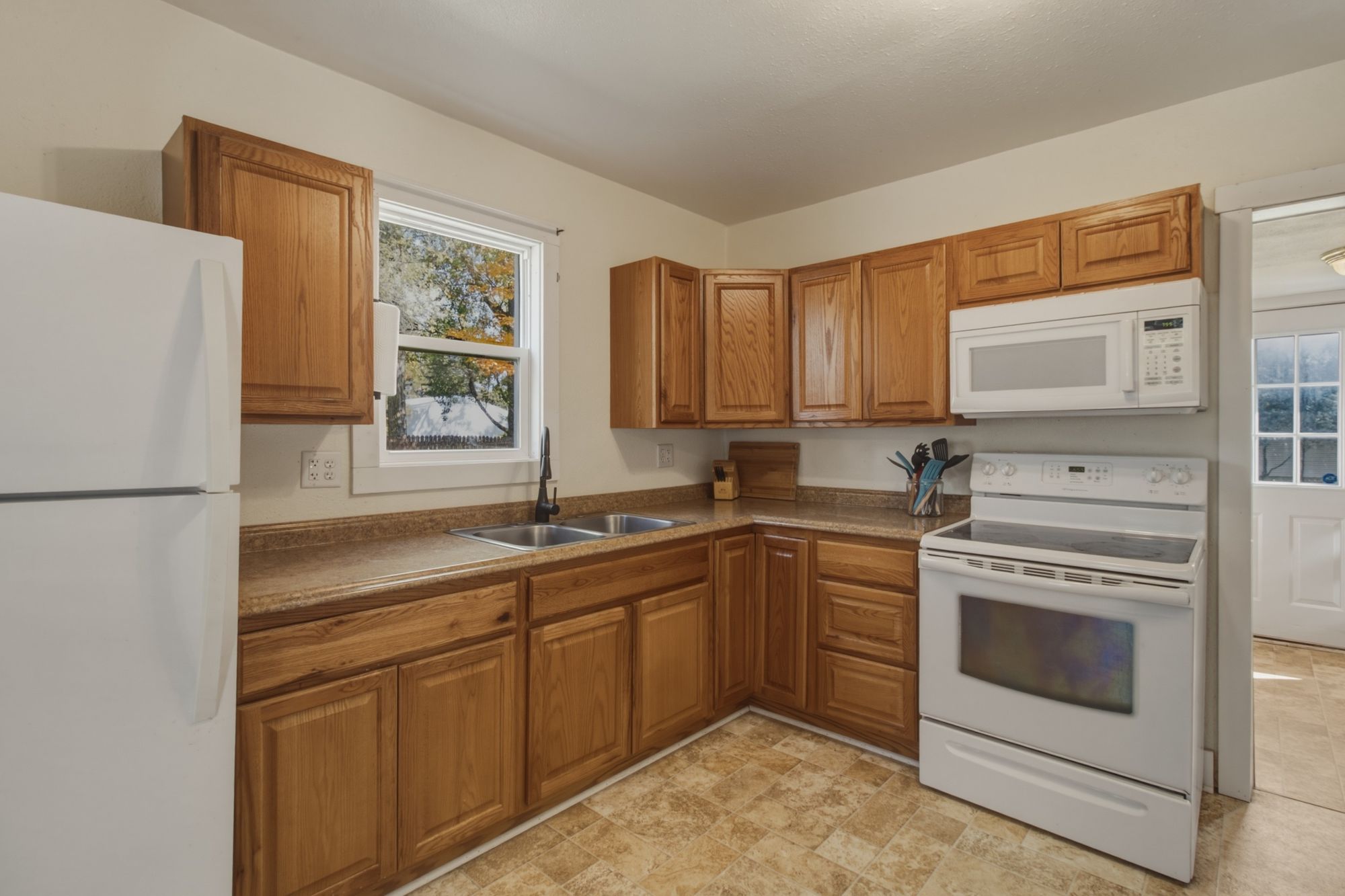 Bright kitchen with oak cabinets