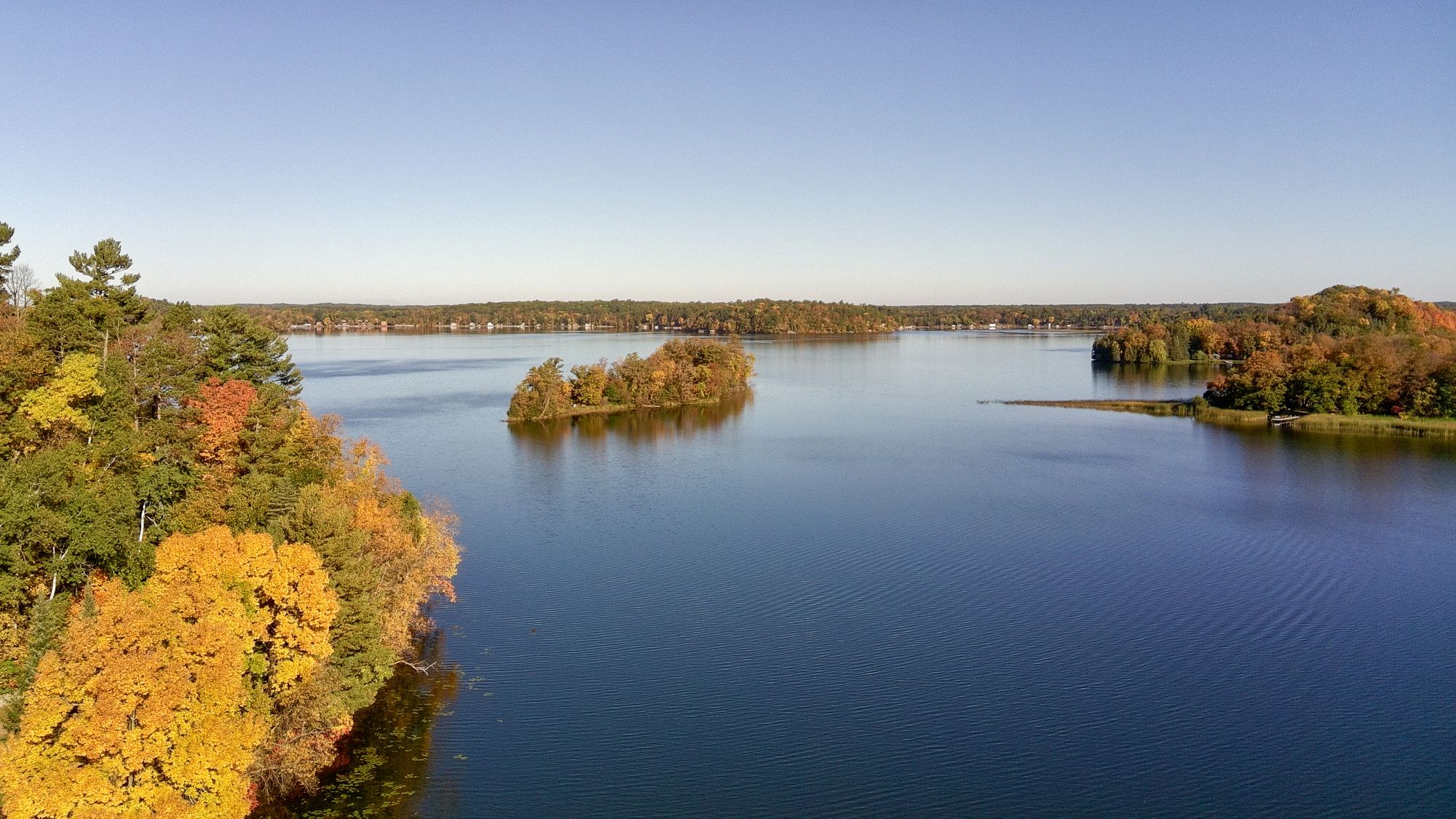 Aerial of lake with fall foliage